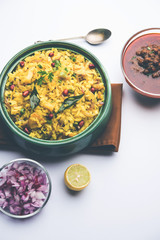 Aloo/Kanda Poha or Tarri Pohe with spicy chana masala/curry. selective focus