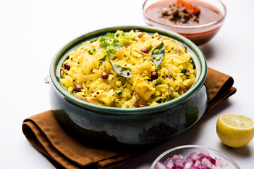 Aloo/Kanda Poha or Tarri Pohe with spicy chana masala/curry. selective focus