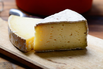 Pieces of French Tomme and Cantal cheese, close up