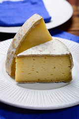 Pieces of French Tomme and Cantal cheese, close up