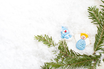 Christmas background with twigs, cones, red berries, angel, lacy snowflakes