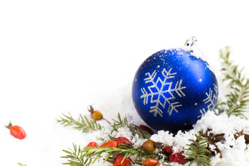 Merry Christmas - Christmas balls on the snow, winter bokeh background, red balls on the snow, rays of light