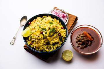 Aloo/Kanda Poha or Tarri Pohe with spicy chana masala/curry. selective focus