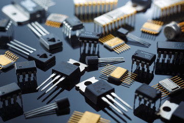 Electronic components close-up. Golden electronic microcircuits. - obrazy, fototapety, plakaty