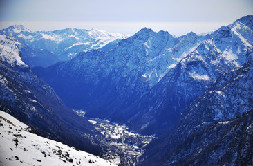 Snowy mountain in the period of March that overlooks the village of Alagna Valsesia
