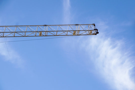 part of arm machinery construction crane with blue sky background