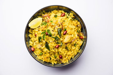 Aloo/Kanda Poha or Tarri Pohe with spicy chana masala/curry. selective focus