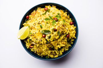 Aloo/Kanda Poha or Tarri Pohe with spicy chana masala/curry. selective focus