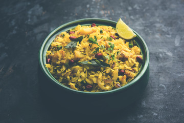 Aloo/Kanda Poha or Tarri Pohe with spicy chana masala/curry. selective focus