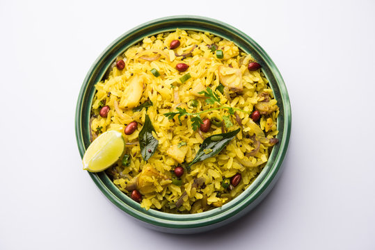 Aloo/Kanda Poha or Tarri Pohe with spicy chana masala/curry. selective focus