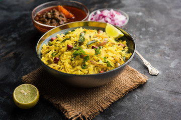 Aloo/Kanda Poha or Tarri Pohe with spicy chana masala/curry. selective focus