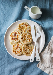 Sour dough pancakes - healthy breakfast, snack on a blue background, top view