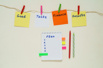 Words Goal, Tasks, Finance, Results, Plan on multicolored paper