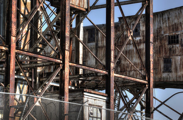 Fototapeta premium Abandoned rusted industrial structures in old port