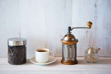 cup of coffee and beans on white background