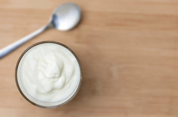 Fototapeta na wymiar Yogurt is a healthy breakfast. Yogurt made from milk fermented by added bacteria, often sweetened and flavored.
