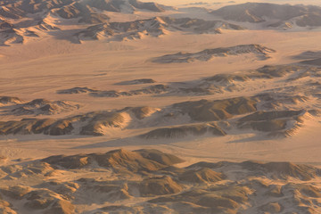 Aerial view on arabian desert and Red sea mountains from the airplane