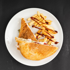 french fries with pita sandwich on the black bakcground