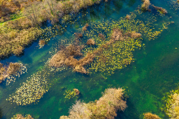 Croatia, beautiful Mreznica river, countryside landscape panoramic view from drone on waterfalls and trees in autumn 