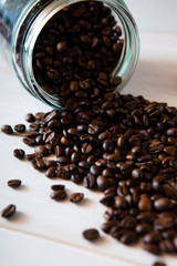 coffee beans on white wooden background