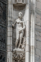 Obraz premium Beautiful statue of Eva at facade of the Cathedral of Milano, Milan, Italy, summer time, details