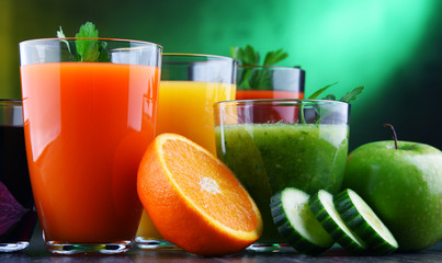 Glasses with fresh organic vegetable and fruit juices