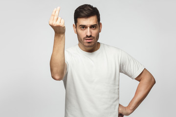 Italian man showing gesture that something is costy and he can not afford it