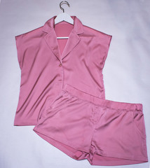 women's silk pink pajamas on white background