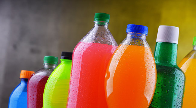 Plastic bottles of assorted carbonated soft drinks