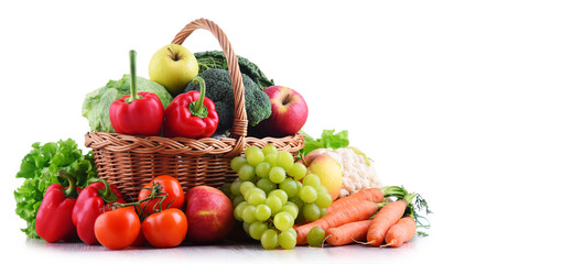 Fresh organic fruits and vegetables in wicker basket