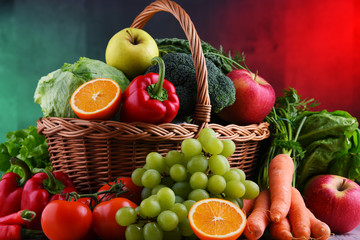 Fresh organic fruits and vegetables in wicker basket