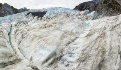 Fototapeta na wymiar Franz Josef Glacier crampons hike through the blue glacier ice - New Zealand, South Island, NZ