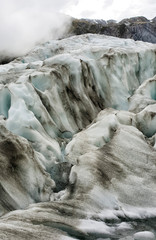 Franz Josef Glacier crampons hike through the blue glacier ice - New Zealand, South Island, NZ