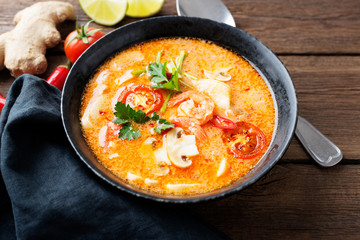 Thai food soup Tom Yam with Coconut milk, Chili pepper and Seafood.