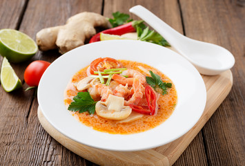 Thai food soup Tom Yam with Coconut milk, Chili pepper and Seafood.