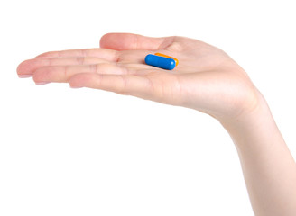 Pill capsule blue in hand medicine health on white background isolation