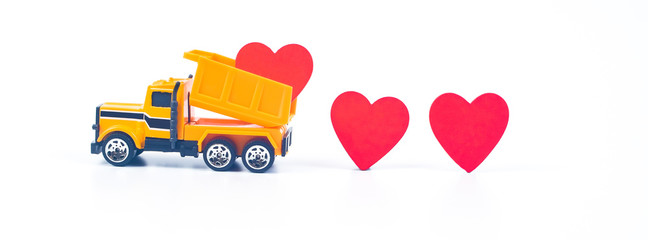 Truck car carry a red hearts sign on white background.Valentine day concept.