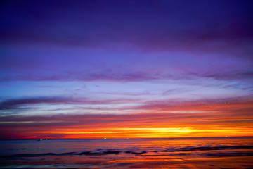 Naklejka na ściany i meble Sunset Sky Background on the beach in summer