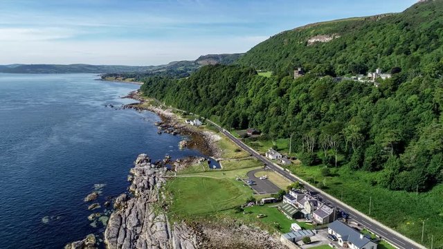 Atlantic coast, Northern Ireland. Garron Point. Geological formation, parking and marina at Antrim Coast Road, a.k.a. Causeway Costal Route. One of the most scenic coastal roads in Europe. Aerial clip