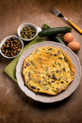 omelette with zucchinis black olives and capers