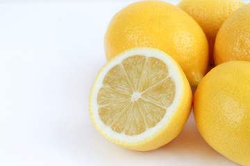 Obraz na płótnie Canvas Fresh lemons on a light background