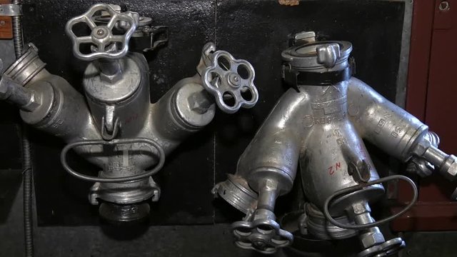 Fire extinguishing equipment. Metalic fireplug for fire fighting. Metal fire hydrant to extinguish a fire.