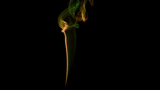 Poisonous Yellow-Green Smoke. Natural Colorful smoke rises up and spins into graceful spirals. Filmed at a speed of 240fps