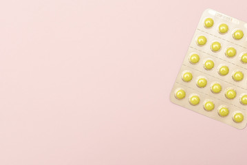 Top view of white blisters with pills on  surface