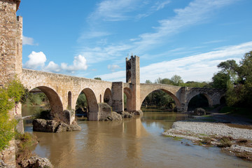Fototapeta na wymiar Seven-span defensive bridge, built by the Romans in the XI-XII centuries. in Besalu, Spain