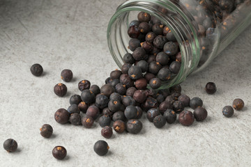 Dried juniper berries in a glass jar