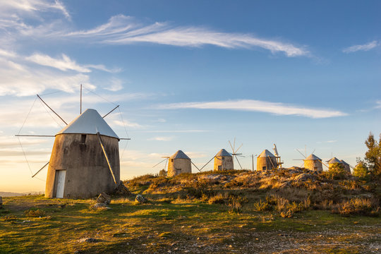 Landscape of Historical Windmills in Penacova Portugal (Moinhos de Gavinhos) on Hill at Sunset