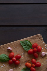 Fresh tomatoes, freshly grown with basil top view