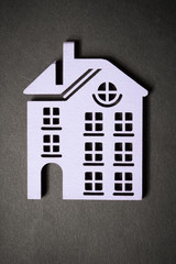 decorative facade of the house with a pipe