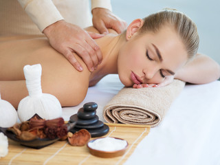 Fototapeta na wymiar Woman having massage in the spa salon